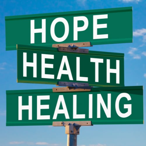 a street sign with the words hope, health, healing displayed