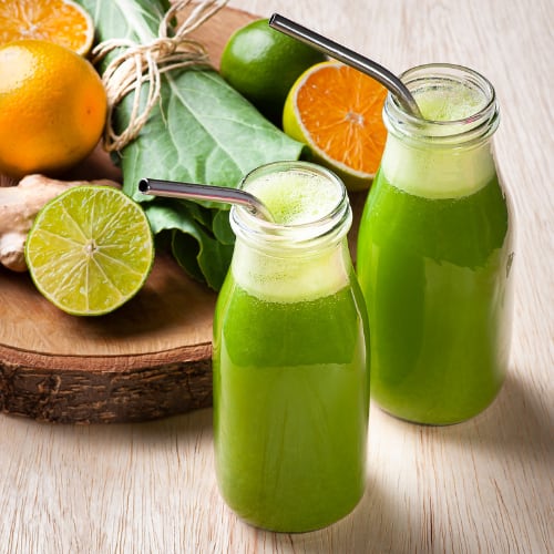 fresh, healthy juice from spinach, oranges and limes