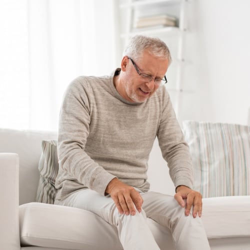 senior man with joint pain in knees