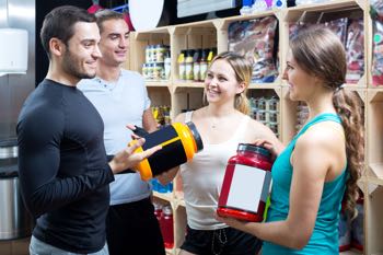 adults discussing bodybuilding supplements