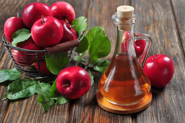fresh apples and resulting apple cider vinegar