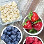 Assortment of Fresh Berries and Nuts on Table