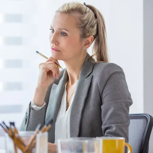 A person sitting calmly after a balanced meal, showing steady energy and focus in a home setting.