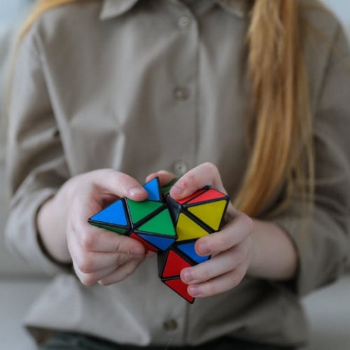 girl playing a brain puzzle