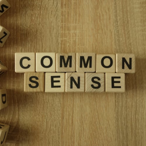 scrabble blocks laid out to spell common sense