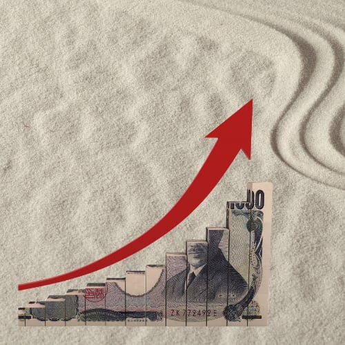 sand on the beach background with financial trends chart depicting wellness economics and trends