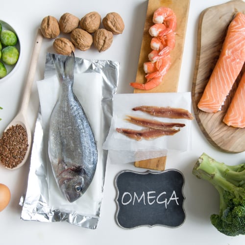 assortment of seafood, nuts and vegetables high in omega fatty acids