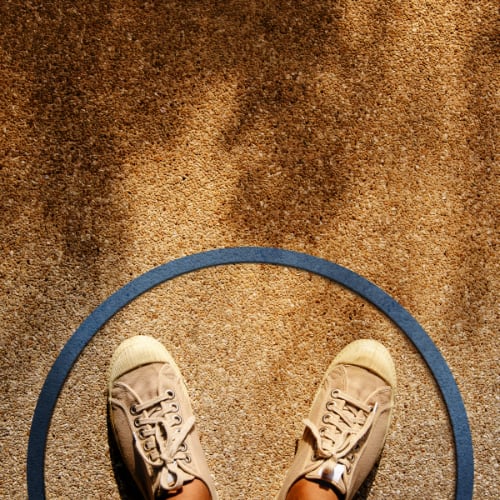 person standing in a circle where the circle represents boundaries to protect the person