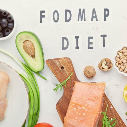 fodmap diet items including avocado, salmon, nuts, tomatoes, blueberries