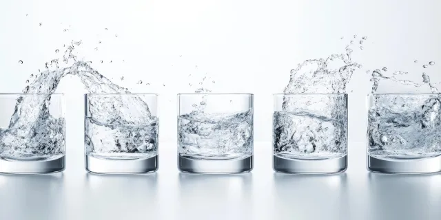 clean drinking water on grey background