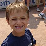 Isaac Wright smiles at a baseball game