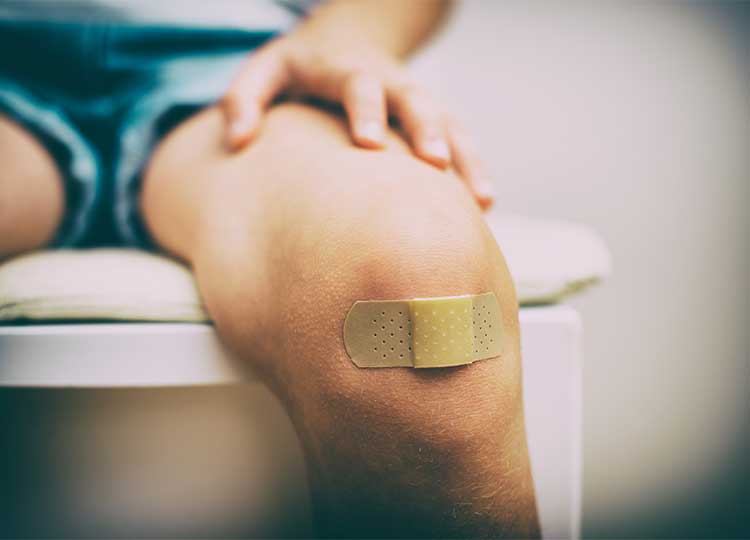 Child's Knee Covered with Band aid