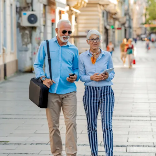An adult walking outdoors in a calm setting, reflecting gradual changes in energy and routine over time.