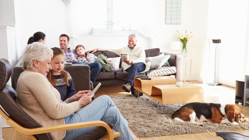 multi-generational family gathering at home spending time eith loved ones