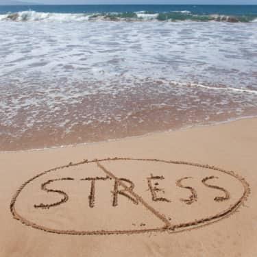 relaxing near ocean water to combat stress