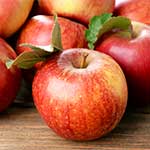 Pile of Apples on Wooden Table