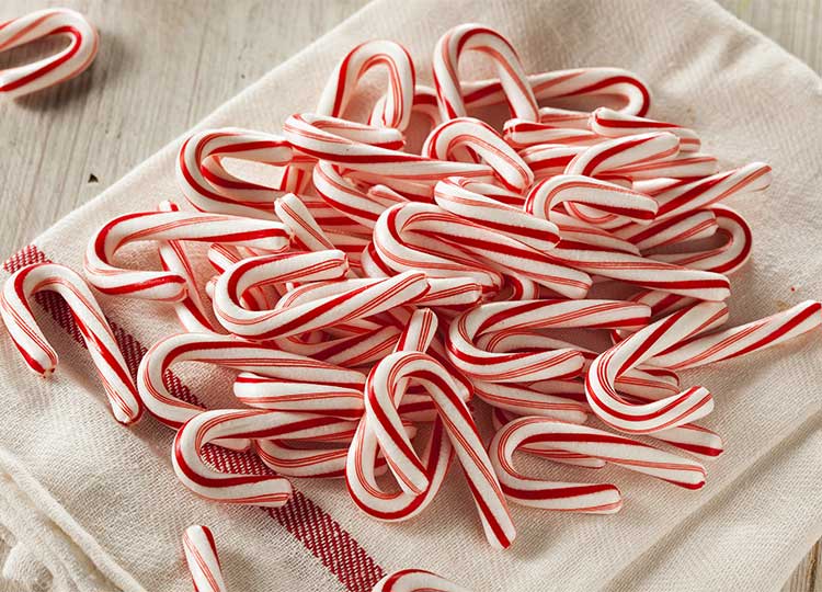 pile of candy canes depicting the sugar cravings people often have when they are malnourished.