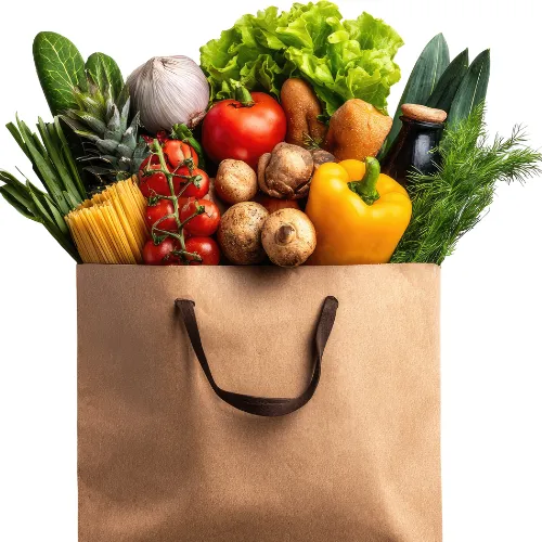 A variety of plant-based meals with vegetables, grains, and legumes prepared in a casual home kitchen.