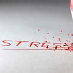 Red Pencil Writing The Word Stress