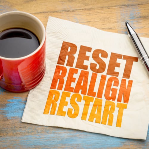 reset, reallign, restart on a napkin with a full coffee mug denoting resetting your metabolism