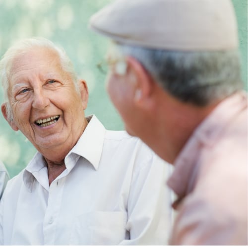 two senior men having a conversation