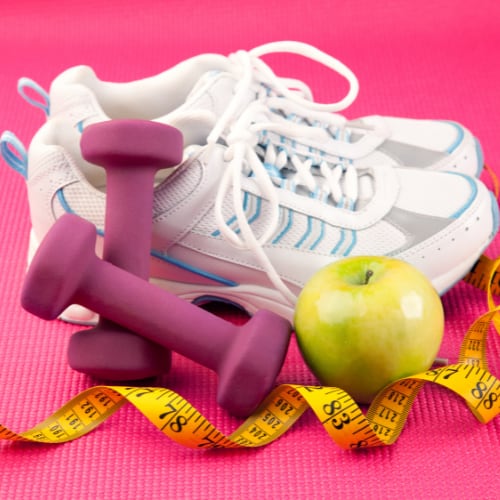 an illustration of supporting aids for a healthy lifestyle including running shoes, handweights, an apple, and a measuring tape.