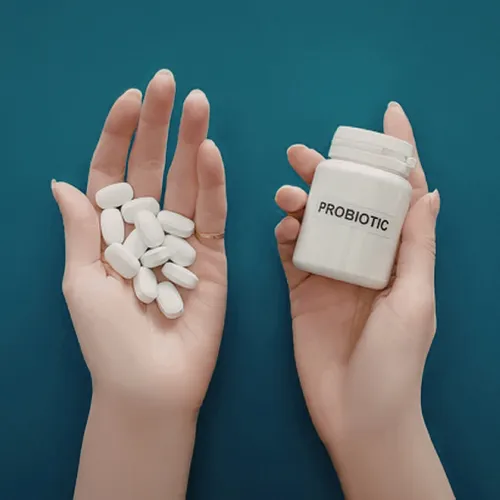Two groups of supplement capsules arranged separately to represent single-strain and multi-strain probiotic approaches.