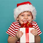 Small Boy with Christmas Hat and Present