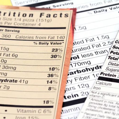 Multiple supplement bottles labeled with terms like focus, calm, and energy arranged on a table.