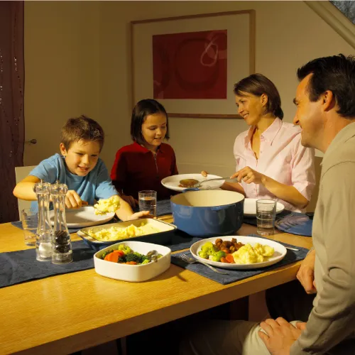 A shared table with traditional foods reflecting cultural eating patterns and everyday routines.