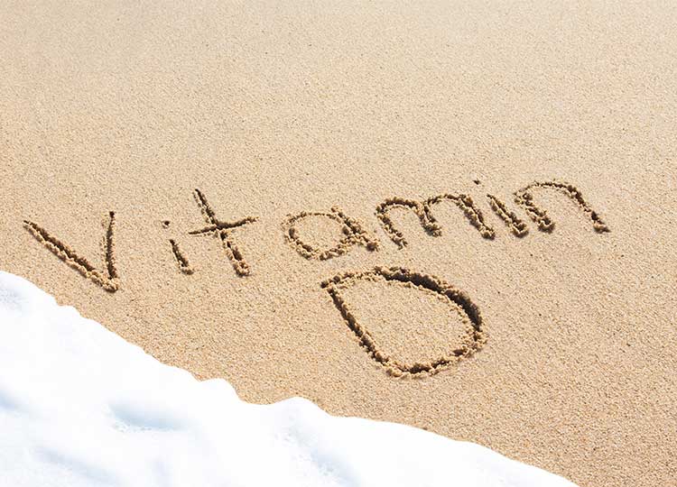 Vitamin D Written in Sand on Beach
