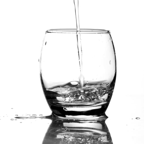 clean, clear water pouring into a glass