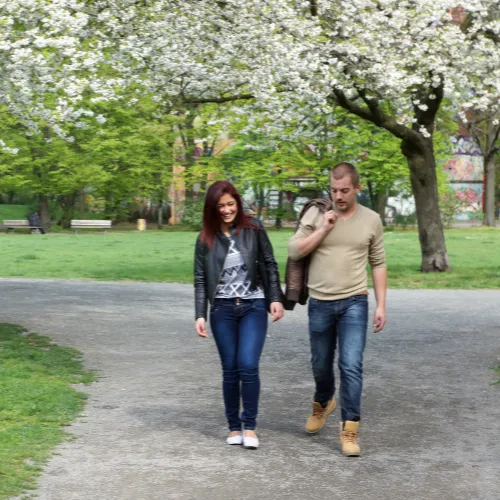 A person taking a quiet walk in a peaceful natural setting, reflecting recovery, renewal, and emotional resilience.