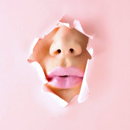 large pink lips on woman's face depicting healthy skin from collagen